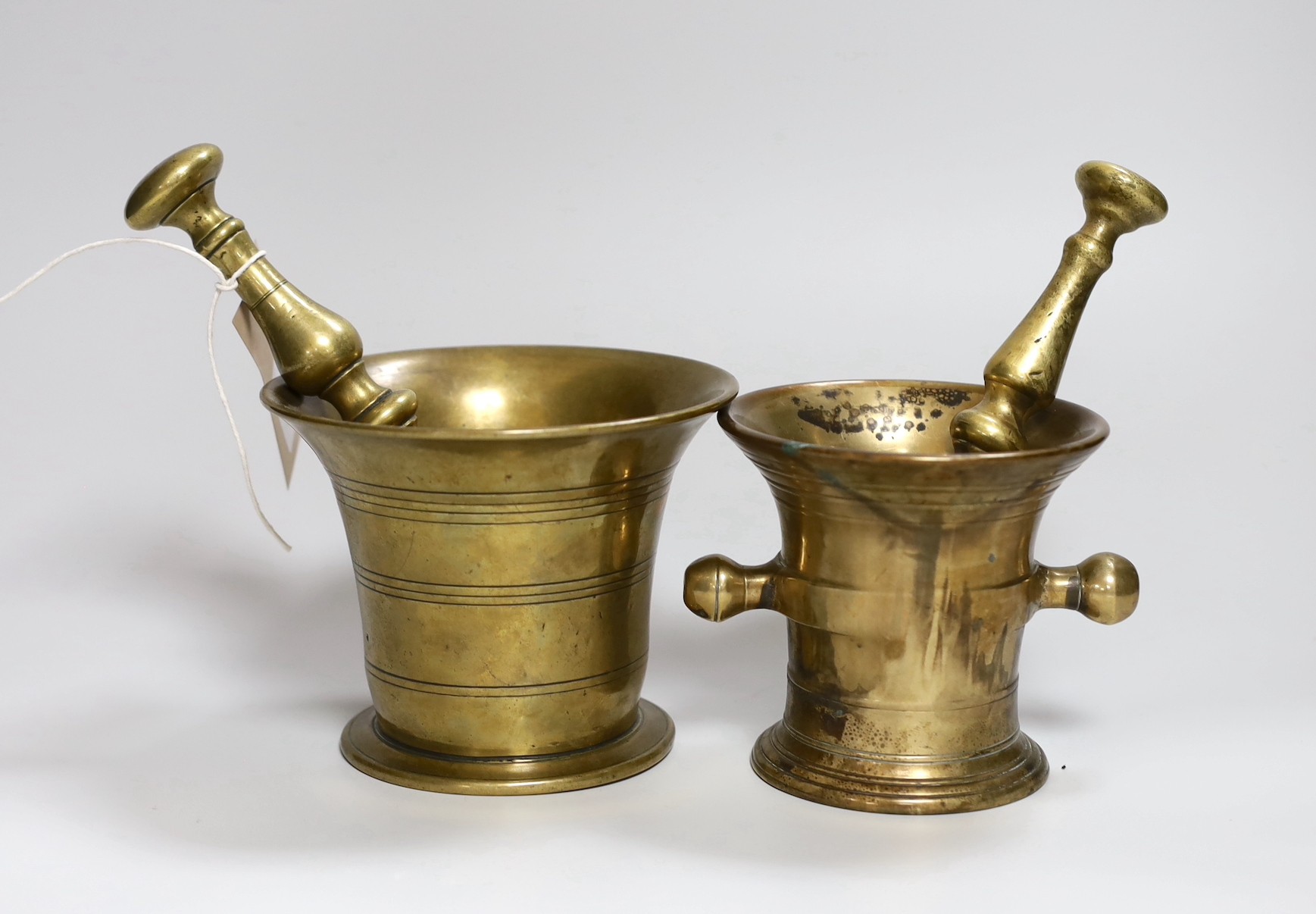 Two 18th/19th century brass mortars, with pestles